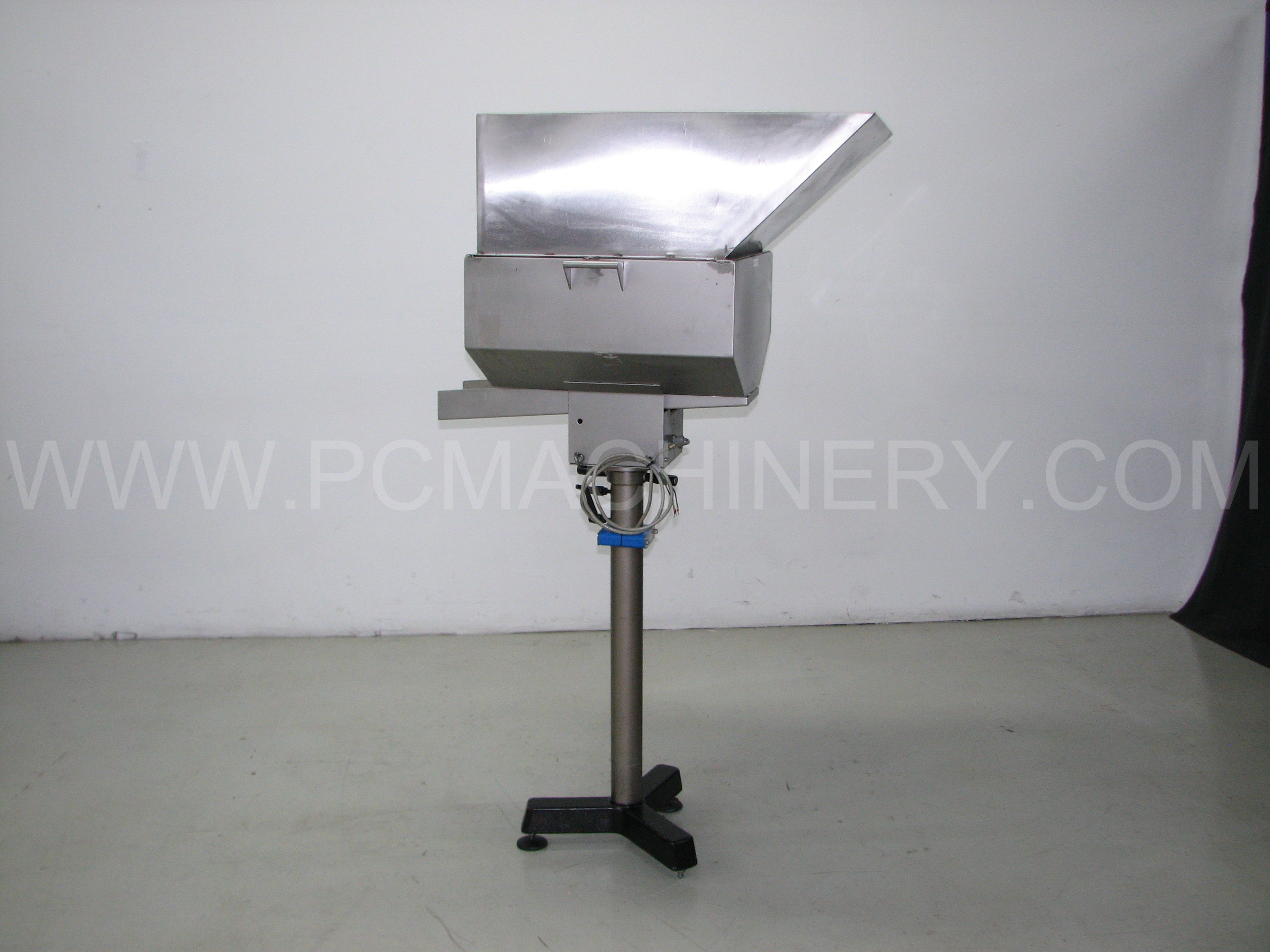Used Stainless steel Orientech vibratory cap feeder with chute