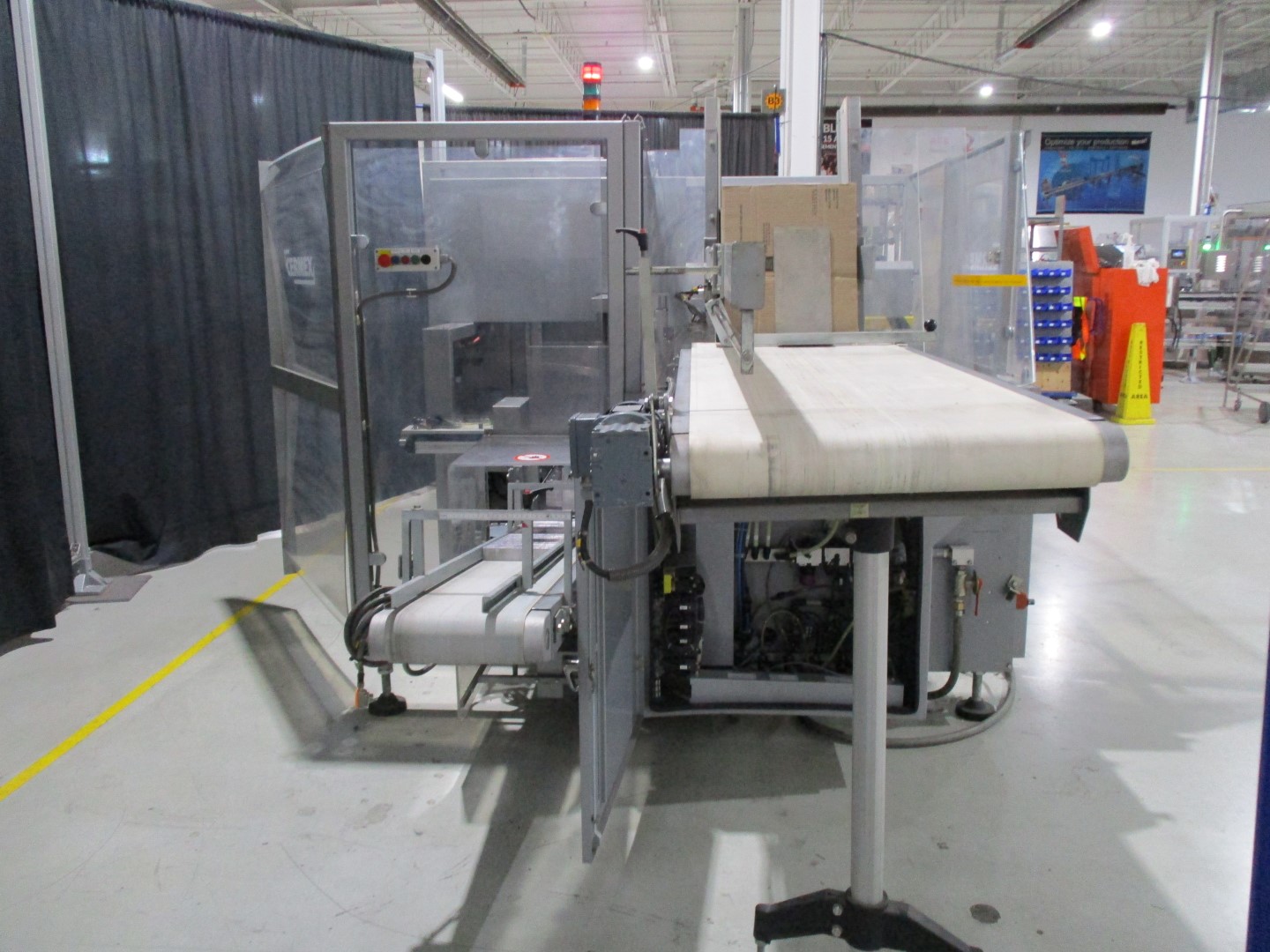 Used Cermex automatic side load case packer model SB27 for glue application