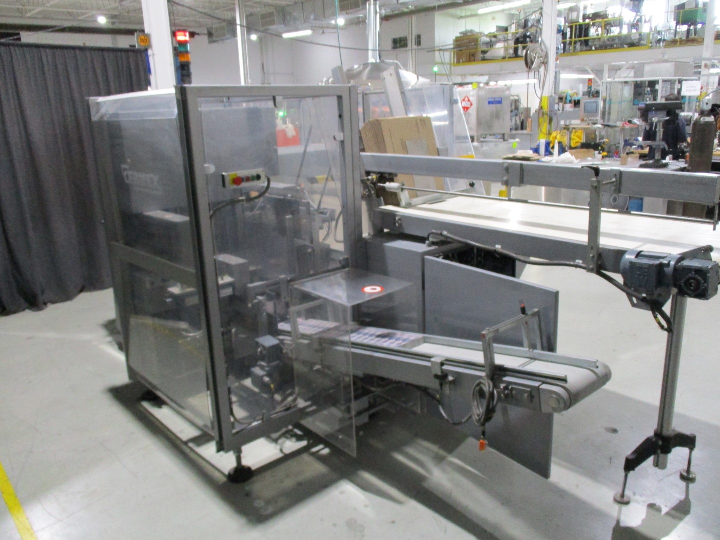 Used Cermex automatic side load case packer model SB27 for glue application