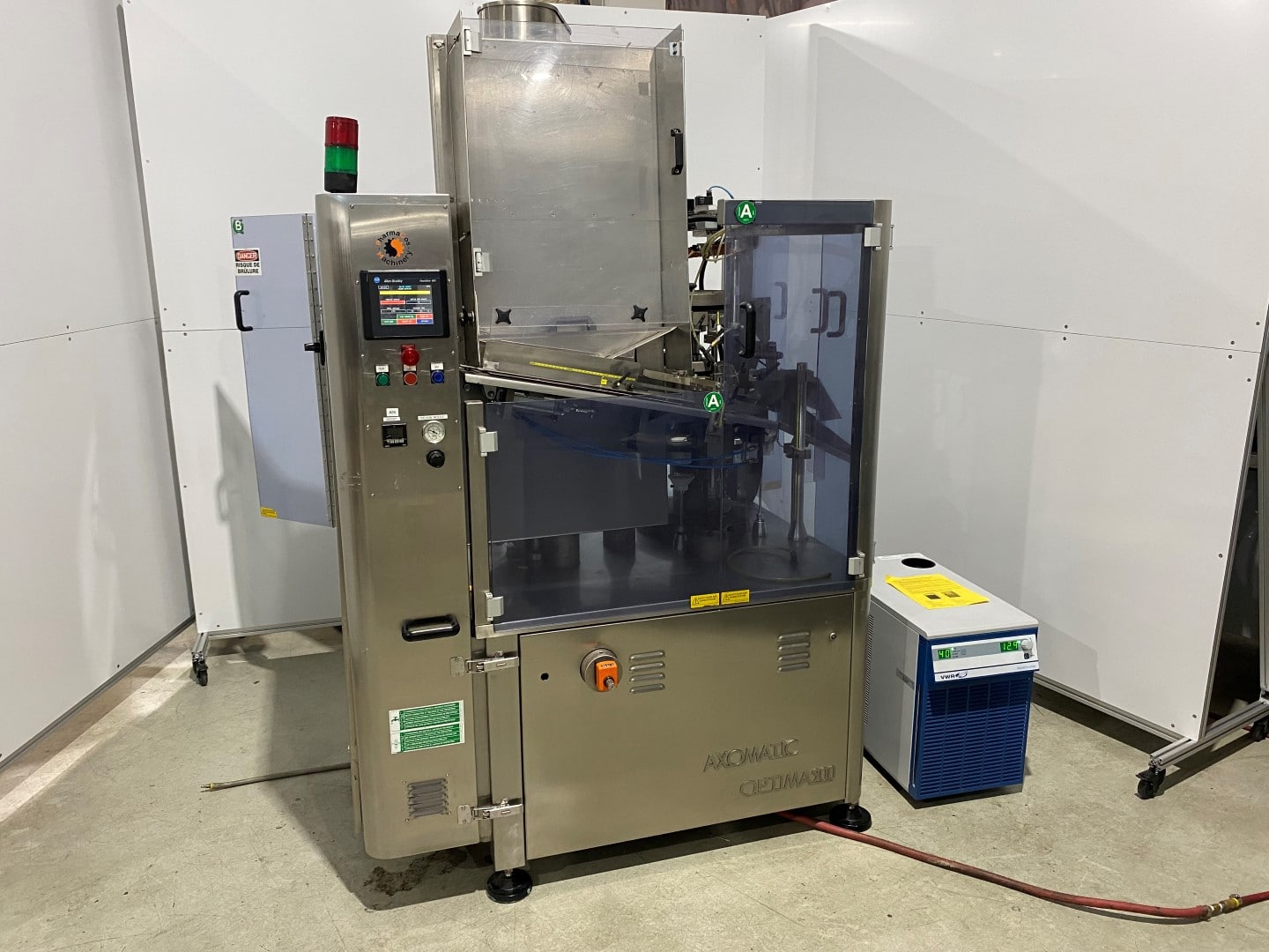 Used Axomatic Optima 900 plastic tube filler with VWR chiller and many filler change parts